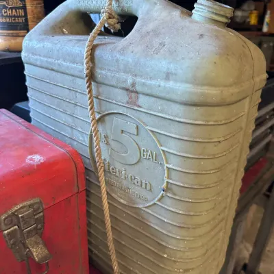 Sale Photo Thumbnail #486: Vintage 5-gallon American plastic gas or water container by United Plastic Corp, showing heavy surface wear and missing its original cap.