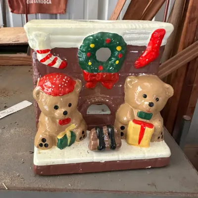 Sale Photo Thumbnail #717: Vintage painted ceramic Christmas fireplace decoration featuring teddy bears, gifts, stockings, and a wreath.