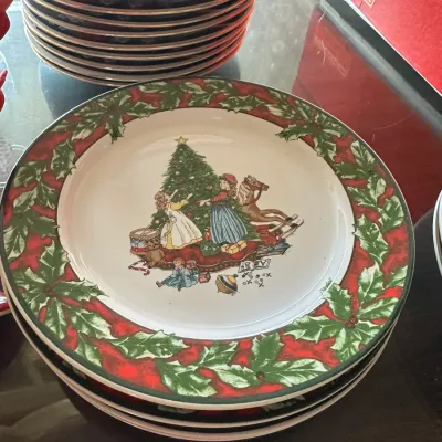 Sale Photo Thumbnail #232: Mikasa 'Festive Season' holiday dinner plates featuring a festive holly border and central illustration of children around a Christmas tree.
