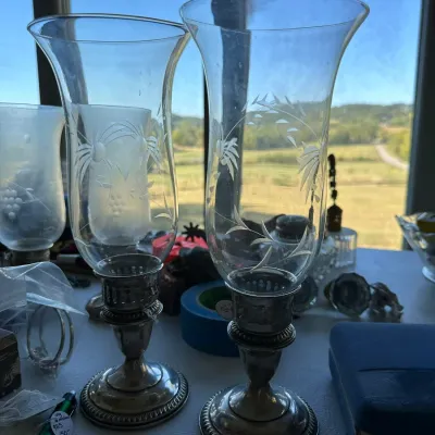 Sale Photo Thumbnail #393: Pair of vintage silver-plated hurricane candle lamps with etched glass shades, featuring a leafy floral motif.