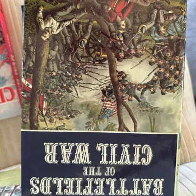 Sale Photo Thumbnail #431: Hardcover copy of 'Battlefields of the Civil War' featuring an illustrated cover, shown upside down.