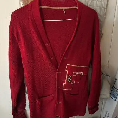 Sale Photo Thumbnail #613: Vintage red varsity letterman cardigan sweater featuring a large Chenille 'F' patch on the left pocket.