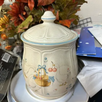 Sale Photo Thumbnail #312: Vintage Pfaltzgraff Yorktowne or similar country geese pattern ceramic canister with lid, featuring geese, fruit, and blue trim.