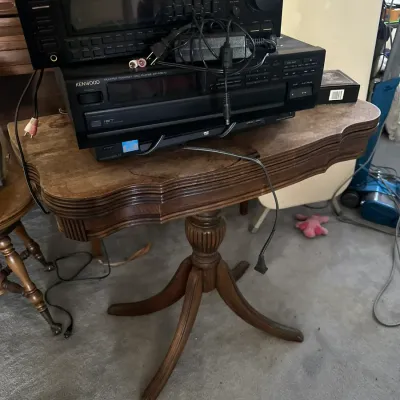 Sale Photo Thumbnail #411: Stack of vintage audio components, including a Pioneer VSX-3300 receiver and a Kenwood CD player, sitting on a wooden pedestal accent table.