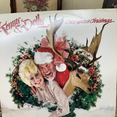 Sale Photo Thumbnail #135: Kenny & Dolly "Once Upon a Christmas" vinyl LP album, released in 1984, showing light cover wear.