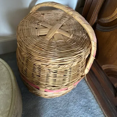 Sale Photo Thumbnail #365: Vintage lidded wicker sewing basket featuring a built-in top handle and a pink accent strip woven around the base.