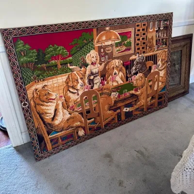 Sale Photo Thumbnail #180: Large vintage framed tapestry depicting dogs playing poker, featuring a patterned decorative border.