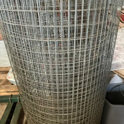Sale Photo Thumbnail #210: Large roll of galvanized wire mesh fencing in used condition.