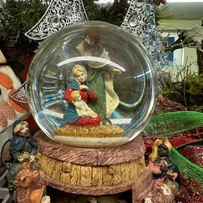 Sale Photo Thumbnail #73: Nativity scene musical snow globe featuring Mary, Joseph, and Baby Jesus inside the globe and three Wise Men with animals around the faux-wood base.