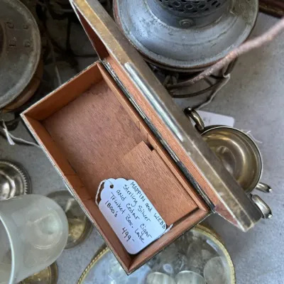 Sale Photo Thumbnail #405: Mappin and Webb sterling silver and cedar-lined cigar trinket box, dating from the late 1800s, shown open among vintage metalwork.