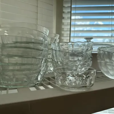 Sale Photo Thumbnail #691: Collection of clear pressed glass prep and dessert bowls arranged on a wire shelf in excellent condition.