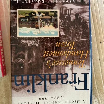 Sale Photo Thumbnail #435: Hardcover copy of "Franklin: Tennessee's Handsomest Town: A Bicentennial History 1799–1999" by James A. Crutchfield and Robert Holladay, featuring its original dust jacket.