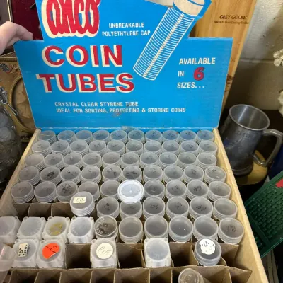 Sale Photo Thumbnail #51: Vintage Anco plastic coin tube store counter display box filled with clear styrene coin storage tubes.