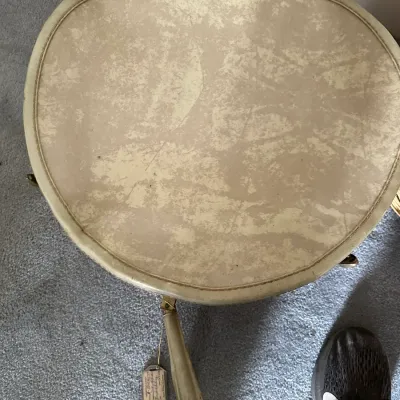 Sale Photo Thumbnail #364: Vintage mid-century round vanity stool with off-white textured vinyl upholstery and tapered metal legs.