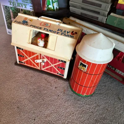 Sale Photo Thumbnail #188: Vintage Fisher-Price Little People Family Farm barn set with matching silo, showing light play wear consistent with age.