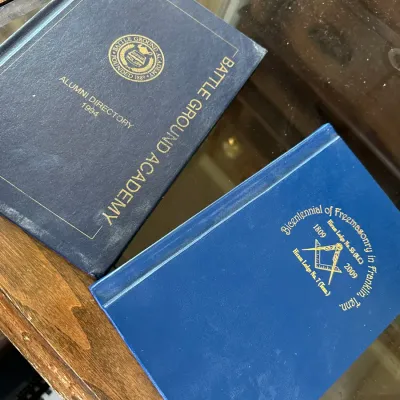 Sale Photo Thumbnail #421: Pair of blue hardcover historical books, including a 1994 Battle Ground Academy Alumni Directory and a 2009 Bicentennial of Freemasonry in Franklin, Tenn. volume.