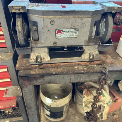 Sale Photo Thumbnail #483: Vintage Kmart 6-inch bench grinder, 1/4 HP model 30-09, showing signs of use and surface dust.