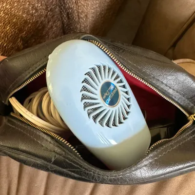 Sale Photo Thumbnail #617: Vintage light blue Presto Mini Dryer portable hair dryer packed inside a black zippered faux leather travel case.