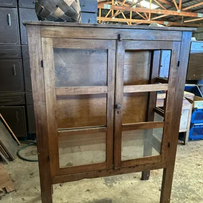 Sale Photo Thumbnail #511: Rustic antique wooden pie safe cabinet featuring double glass pane doors, straight legs, and a top woven basket.