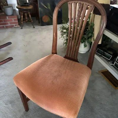 Sale Photo Thumbnail #265: Vintage wooden dining chair featuring an oval shield back with vertical slats and a plush peach-colored corduroy upholstered seat.