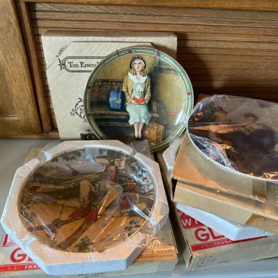 Sale Photo Thumbnail #193: Collection of Norman Rockwell collector plates by The Edwin M. Knowles China Company, featuring various illustrated scenes with original packaging.