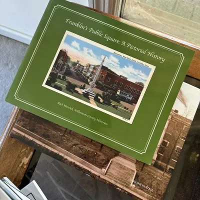 Sale Photo Thumbnail #447: Paperback copy of 'Franklin's Public Square: A Pictorial History' by Rick Warwick, featuring local historical photo illustrations on the cover.