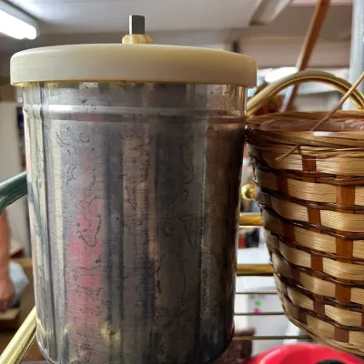 Sale Photo Thumbnail #87: Vintage metal ice cream maker insert or churn canister with off-white lid, showing some age and patina.