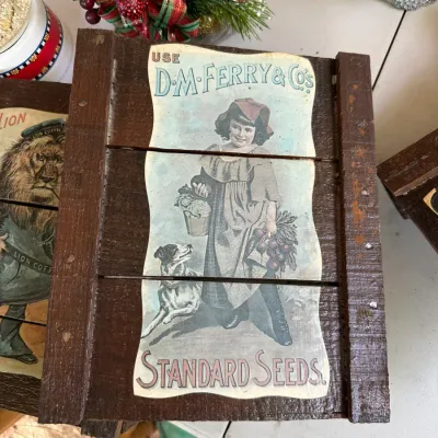Sale Photo Thumbnail #160: Vintage-style wooden seed box featuring a D.M. Ferry & Co's Standard Seeds label with a young girl and dog.
