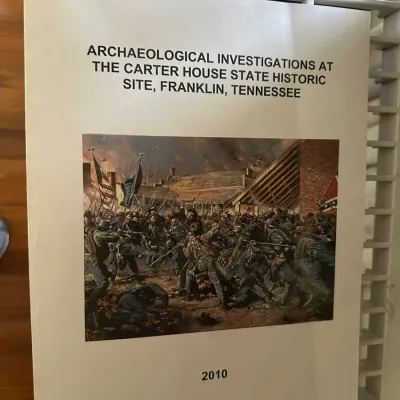 Sale Photo Thumbnail #437: Copy of the 2010 report "Archaeological Investigations at the Carter House State Historic Site, Franklin, Tennessee" featuring a Civil War battle illustration on the cover.