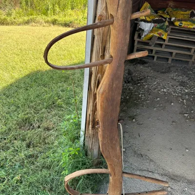 Sale Photo Thumbnail #179: Antique hand-carved wooden double ox yoke with original bentwood bows and peg fasteners, showing weathered patina and age-appropriate wear.