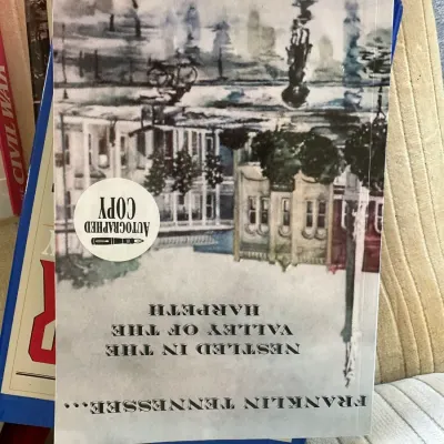 Sale Photo Thumbnail #433: Softcover copy of "Franklin Tennessee... Nestled in the Valley of the Harpeth" by Leonard Isaacs, featuring an autographed copy sticker on the front cover.