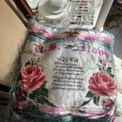 Sale Photo Thumbnail #201: Vintage World War II era U.S. Navy silk pillow cover with fringed border, featuring printed military graphics, roses, and a poem dedicated 'To My Wife'.