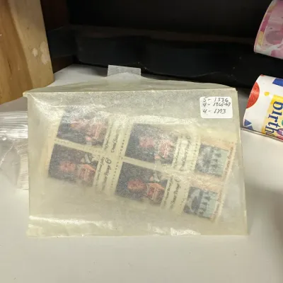 Sale Photo Thumbnail #113: Vintage United States 6-cent postage stamp blocks enclosed in a translucent glassine protective sleeve.