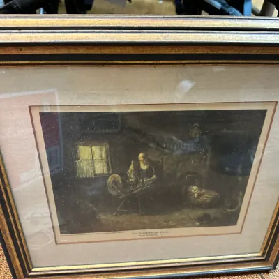 Sale Photo Thumbnail #58: Framed vintage print titled "The Old Spinning Wheel," depicting a interior domestic scene, presented in an ornate black and gold wood frame with matting.