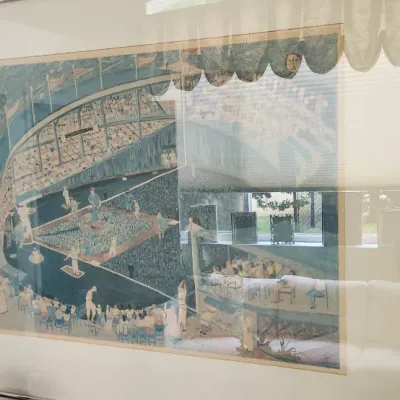 Sale Photo Thumbnail #277: Large framed vintage art print depicting a busy baseball stadium scene, presented in a thin metallic frame alongside a smaller framed camel artwork.