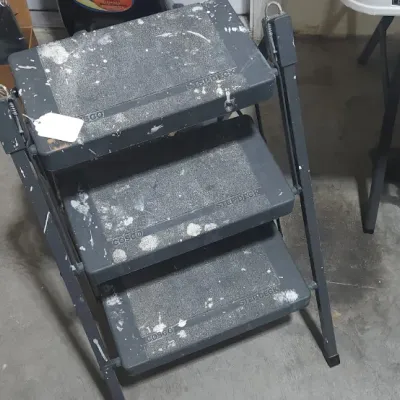 Sale Photo Thumbnail #359: Cosco Stepdeck three-step folding stool with metal frame, showing paint splatters from heavy use.