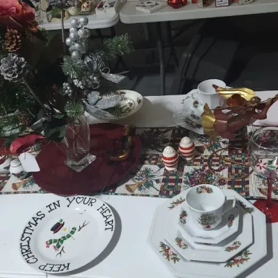 Sale Photo Thumbnail #333: Collection of Christmas-themed tableware, including Fairfield porcelain sets in original boxes, holly pattern plates, teacups, and festive table decorations.