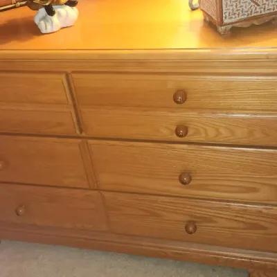 Sale Photo Thumbnail #178: Light oak wooden dresser featuring six drawers with matching wooden knobs.
