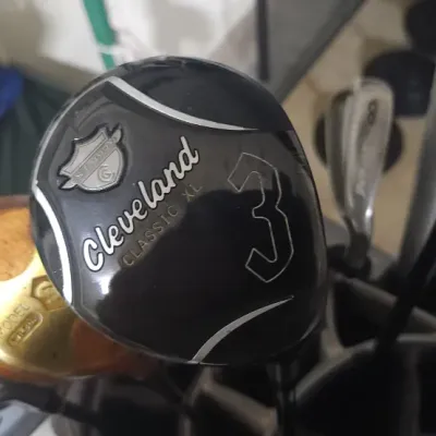 Sale Photo Thumbnail #347: Cleveland Classic XL 3-wood golf club, shown alongside other assorted golf clubs in a golf bag.