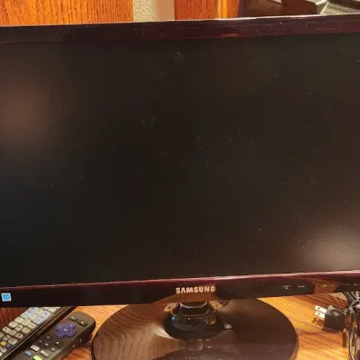 Sale Photo Thumbnail #100: Samsung SyncMaster T22B350 22-inch LED monitor with power cord and remotes.