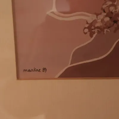 Sale Photo Thumbnail #173: Framed artwork depicting a blooming tree against stylized hills in muted pink and brown tones, signed 'martine 89'.