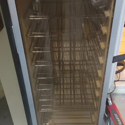 Sale Photo Thumbnail #371: Haier freestanding wine cooler cooler with glass front door, silver bezel, and internal wire racking.