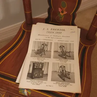 Sale Photo Thumbnail #180: Hand-painted wooden children's chair featuring floral and striping details, displayed with a vintage 1966 J. S. Ebersol Chair Shop catalog.