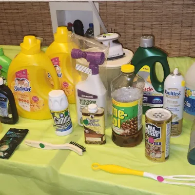 Sale Photo Thumbnail #246: Assortment of household cleaning supplies, laundry detergents, and a red Kidde fire extinguisher arranged on a table.