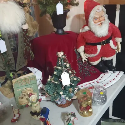 Sale Photo Thumbnail #336: Collection of vintage and rustic Christmas decorations, including Santa Claus figurines, miniature trees, ornaments, and holiday decor.