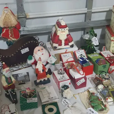 Sale Photo Thumbnail #338: Collection of Christmas decorations and figures, including Santa Clauses, sleigh tabletop accents, ornaments in original boxes, and a wooden nativity scene.