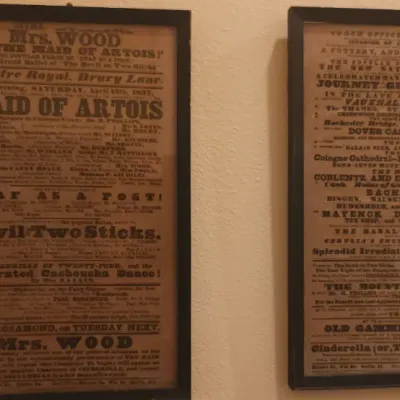 Sale Photo Thumbnail #137: Pair of framed vintage British theatre broadside prints mounted in simple dark frames.