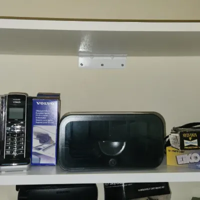 Sale Photo Thumbnail #280: Collection of small household electronics, including VTech cordless phones, a Sony Dream Machine clock radio with its original box, and projection lamp bulbs.