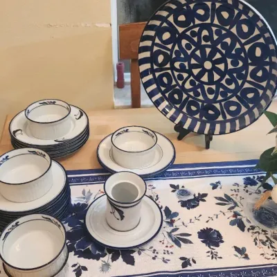 Sale Photo Thumbnail #240: Collection of blue and white ceramic tableware, including small bowls, saucers, a toothpick holder, and a large display platter with bold geometric patterns.