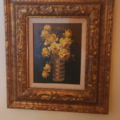 Sale Photo Thumbnail #5: Framed still life oil painting featuring yellow roses in a striped vase, housed in an ornate gilded frame.